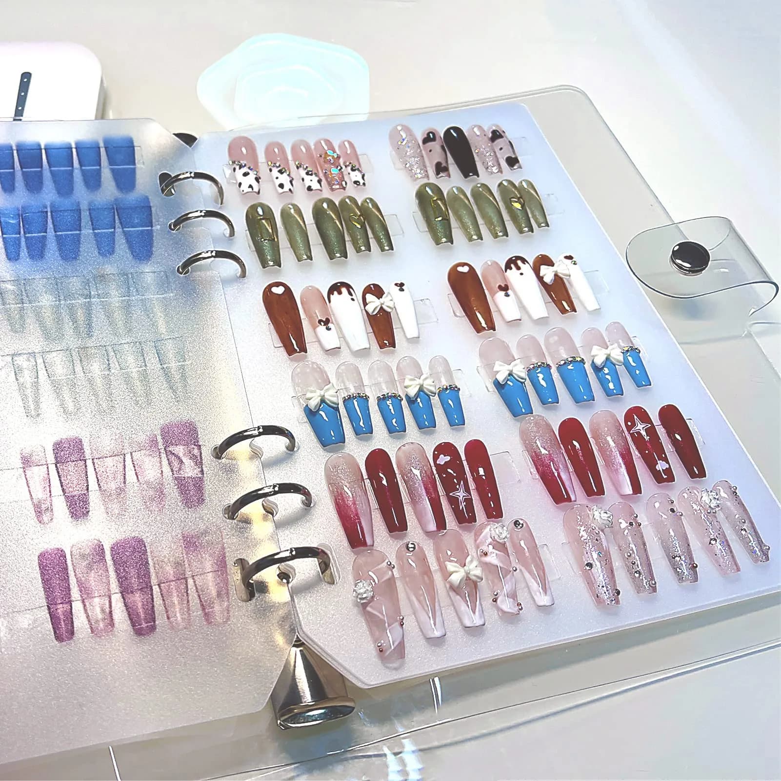 GUXACU Clear Press On Nail Organizer Book with 6 Pages & 60 Adhesive Strips | Stores 36-48 Sets - main product image